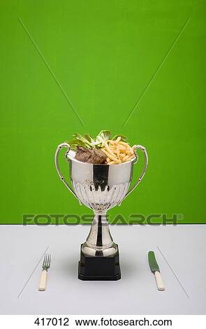 Stock Image - Loving cup full of food. Fotosearch
