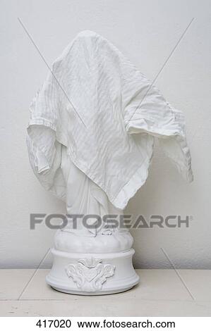 White figurine covered by white cloth View Large Photo Image Stock Image - White figurine covered by white cloth. Fotosearch