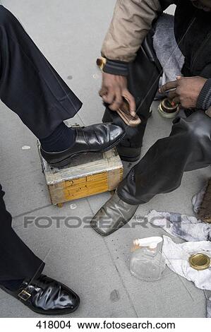 A shoe shiner in New York View Large Photo Image Picture - A shoe shiner in New York. Fotosearch