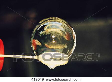 Bubble sitting on a bubble wand View Large Photo Image Stock Photo - Bubble sitting on a bubble wand. Fotosearch