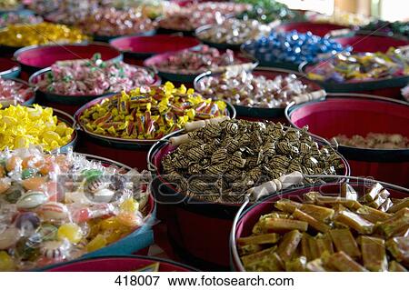 Buckets of sweets on a market View Large Photo Image Stock Photo - Buckets of sweets on a market. Fotosearch