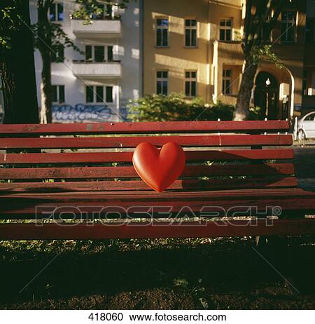 Red heart on an empty bench View Large Photo Image Stock Image - Red heart on an empty bench. Fotosearch