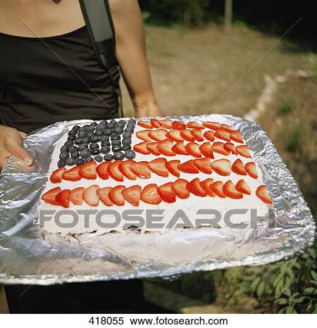 Stock Photography - Woman carrying a cake. Fotosearch