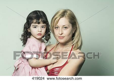 Mother holding daughter View Large Photo Image Picture - Mother holding daughter. Fotosearch