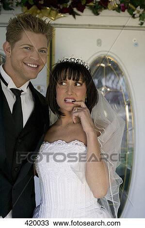 An anxious bride standing next to a happy groom View Large Photo Image Stock Image - An anxious bride standing next to a happy groom. Fotosearch