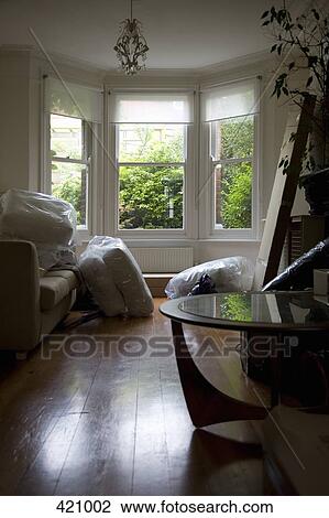 Messy living room whilst moving house View Large Photo Image Stock Image - Messy living room whilst moving house. Fotosearch