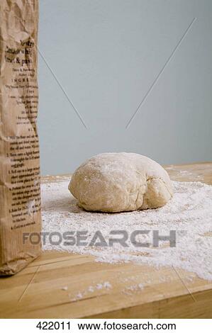 A bag of flour and a ball of dough on a kitchen counter View Large Photo Image Stock Image - A bag of flour and a ball of dough on a kitchen counter. Fotosearch