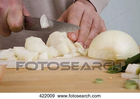 A man chopping onions View Large Photo Image Stock Photo - A man chopping onions. Fotosearch