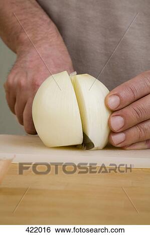 A man slicing an onion View Large Photo Image Stock Photograph - A man slicing an onion. Fotosearch