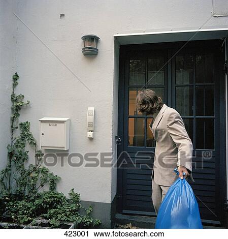 A man taking out the trash View Large Photo Image Stock Image - A man taking out the trash. Fotosearch