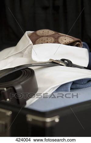 Open suitcase with clothing and accessories View Large Photo Image Picture - Open suitcase with clothing and accessories. Fotosearch