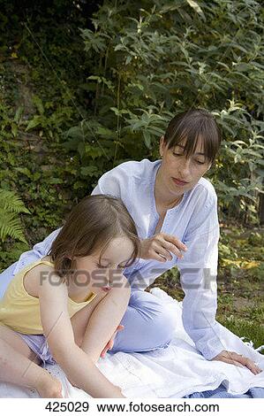 A mother and daughter at a picnic View Large Photo Image Stock Photo - A mother and daughter at a picnic. Fotosearch