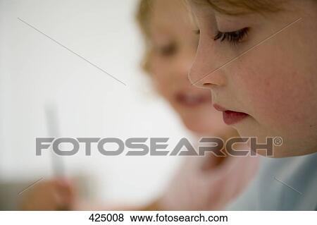Two girls drawing View Large Photo Image Stock Photo - Two girls drawing. Fotosearch