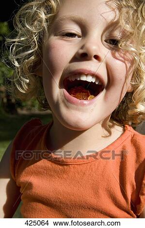 Young girl with a mouthful of jello View Large Photo Image Picture - Young girl with a mouthful of jello. Fotosearch