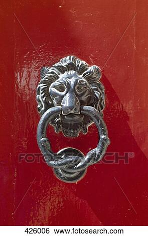 Door knocker with a lion's head View Large Photo Image Stock Photograph - Door knocker with a lion's head. Fotosearch