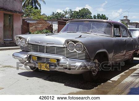 Stock Image - Vintage car parked on a street, Havana, Cuba. Fotosearch