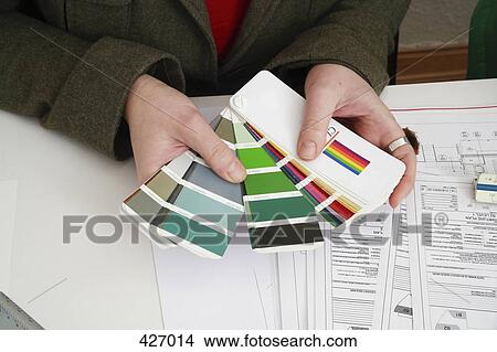 Person looking at color samples View Large Photo Image Picture - Person looking at color samples. Fotosearch