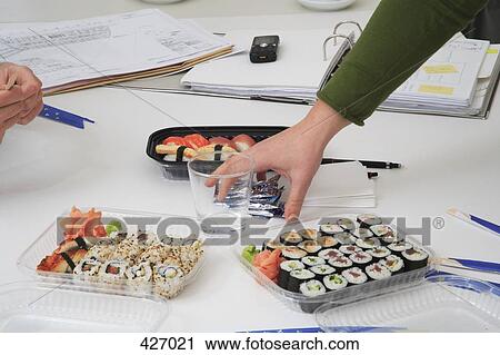 Sushi lunch at work View Large Photo Image Stock Image - Sushi lunch at work. Fotosearch