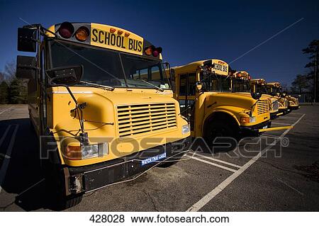 Stock Photo - A row of school buses. Fotosearch