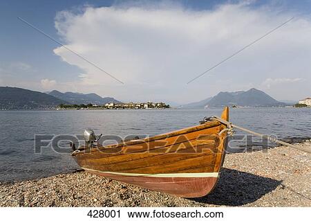 Stock Image - Boat moored at the edge of a lake. Fotosearch