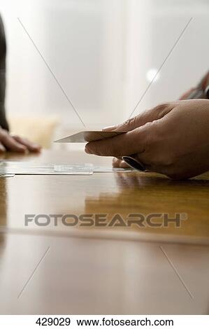 Two woman using tarot cards at a table View Large Photo Image Stock Photo - Two woman using tarot cards at a table. Fotosearch