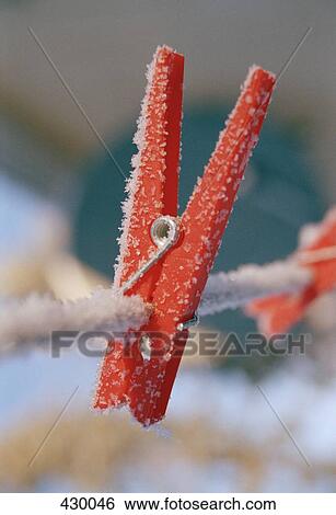 Red peg on a clothesline covered in frost View Large Photo Image Stock Photograph - Red peg on a clothesline covered in frost. Fotosearch