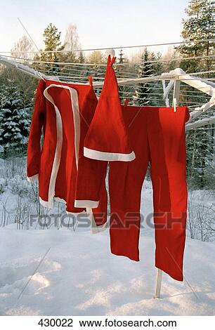 Santa Claus costume hanging on a clothesline View Large Photo Image Stock Image - Santa Claus costume hanging on a clothesline. Fotosearch