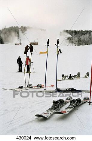 Picture - Ski equipment and people on the slopes at a ski resort. Fotosearch