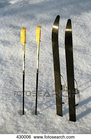 Skis and ski poles in the snow View Large Photo Image Stock Photograph - Skis and ski poles in the snow. Fotosearch
