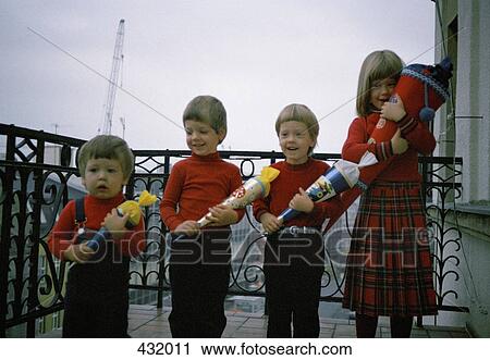 Four children standing in a row View Large Photo Image Stock Image - Four children standing in a row. Fotosearch