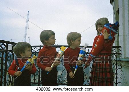 Four children standing in a row View Large Photo Image Stock Image - Four children standing in a row. Fotosearch