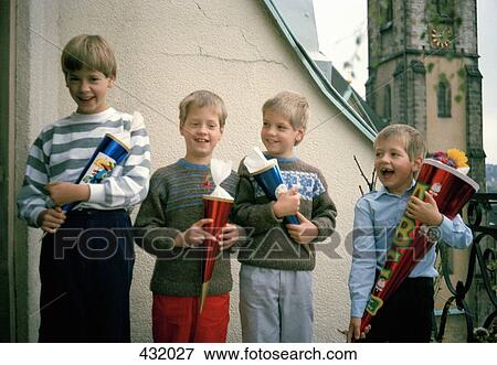 Four children standing in a row View Large Photo Image Stock Photo - Four children standing in a row. Fotosearch