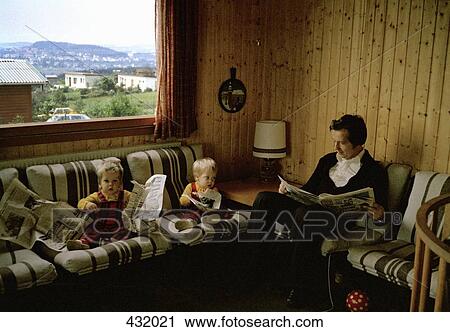 Two toddlers reading the newspaper with father View Large Photo Image Stock Image - Two toddlers reading the newspaper with father. Fotosearch