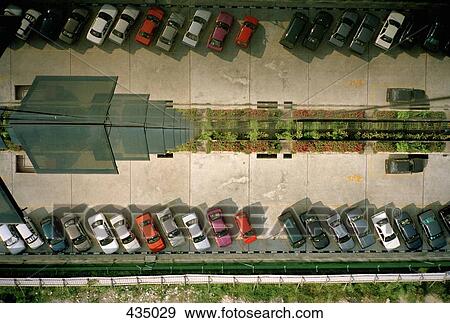 Cars parked in front of a high rise building, Kuala Lumpur, Malaysia View Large Photo Image Stock Photo - Cars parked in front of a high rise building, Kuala Lumpur, Malaysia. Fotosearch