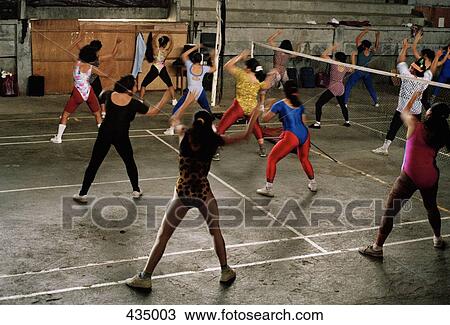 Woman doing aerobics in a gym View Large Photo Image Stock Image - Woman doing aerobics in a gym. Fotosearch