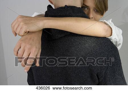 A couple embracing View Large Photo Image Stock Photograph - A couple embracing. Fotosearch