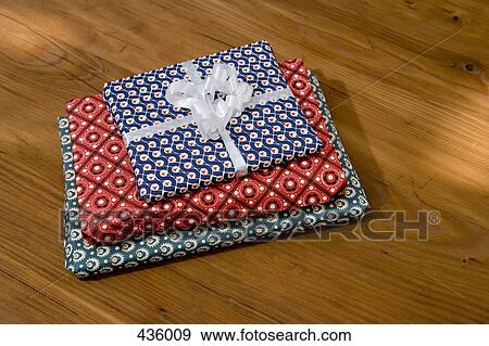 Presents on a table View Large Photo Image Stock Photo - Presents on a table. Fotosearch