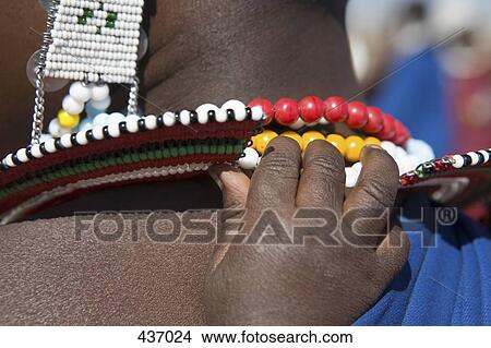 Child's hand touching mother's necklace View Large Photo Image Picture - Child's hand touching mother's necklace. Fotosearch