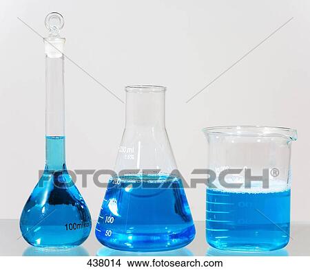 Picture - Blue solution in assorted laboratory glassware. Fotosearch