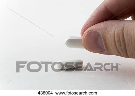Close-up of a man with two tablets View Large Photo Image Picture - Close-up of a man with two tablets. Fotosearch