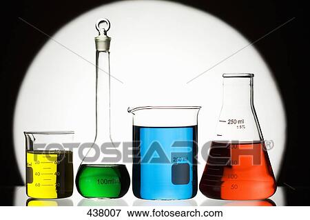Stock Photo - Colored solutions in assorted laboratory glassware. Fotosearch