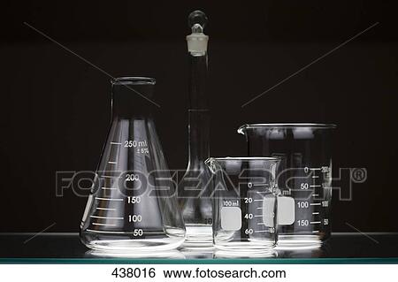 Laboratory glassware on a shelf View Large Photo Image Stock Photograph - Laboratory glassware on a shelf. Fotosearch