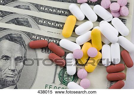 Pills and tablets on top of US paper currency View Large Photo Image Stock Photography - Pills and tablets on top of US paper currency. Fotosearch