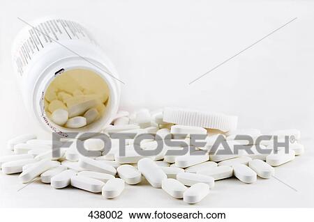 Pills spilling out of an open bottle View Large Photo Image Stock Image - Pills spilling out of an open bottle. Fotosearch