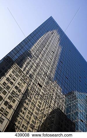 A building reflected in the facade of a skyscraper View Large Photo Image Stock Photo - A building reflected in the facade of a skyscraper. Fotosearch