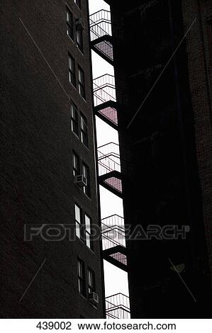 Stock Image - A stairwell between apartment buildings. Fotosearch