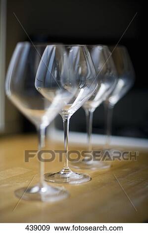 Four empty wineglasses in a row View Large Photo Image Stock Photo - Four empty wineglasses in a row. Fotosearch
