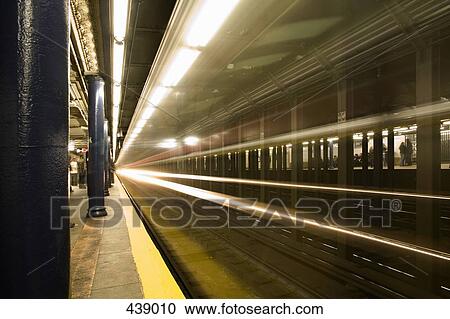 Train moving through subway station View Large Photo Image Stock Image - Train moving through subway station. Fotosearch