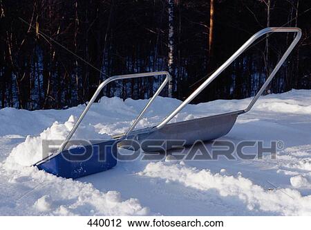 Two snow shovels side by side View Large Photo Image Stock Image - Two snow shovels side by side. Fotosearch