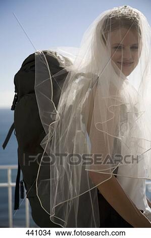 A bride wearing a backpack View Large Photo Image Picture - A bride wearing a backpack. Fotosearch
